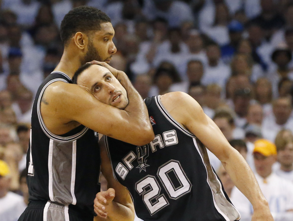 San Antonio Spurs forward Tim Duncan, left, and Manu Ginobili celebrate after Ginobili hit a 3-point basket in the final minutes against the Oklahoma City Thunder in the second half of Game 6 of the Western Conference finals NBA basketball playoff series in Oklahoma City, Saturday, May 31, 2014. (AP Photo/Sue Ogrocki) ORG XMIT: TXKJ152